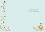 Inside of the greeting card with a light blue background. The left edge features a decorative vertical border of red tulips, yellow daffodils, white sheep, and bunnies. The bottom right corner shows a smaller cluster of a hen, two chicks, and flowers. Text reads: 'And HOPING THE JOY LASTS ALL YEAR THROUGH!'