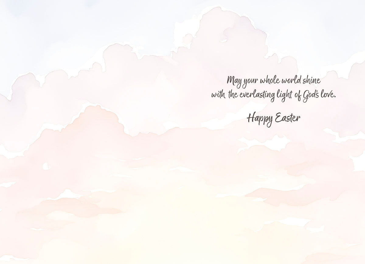 Inside of a religious celebration card with soft watercolor clouds and an inspiring message: 'May your whole world shine with the everlasting light of God's love. Happy Easter.'