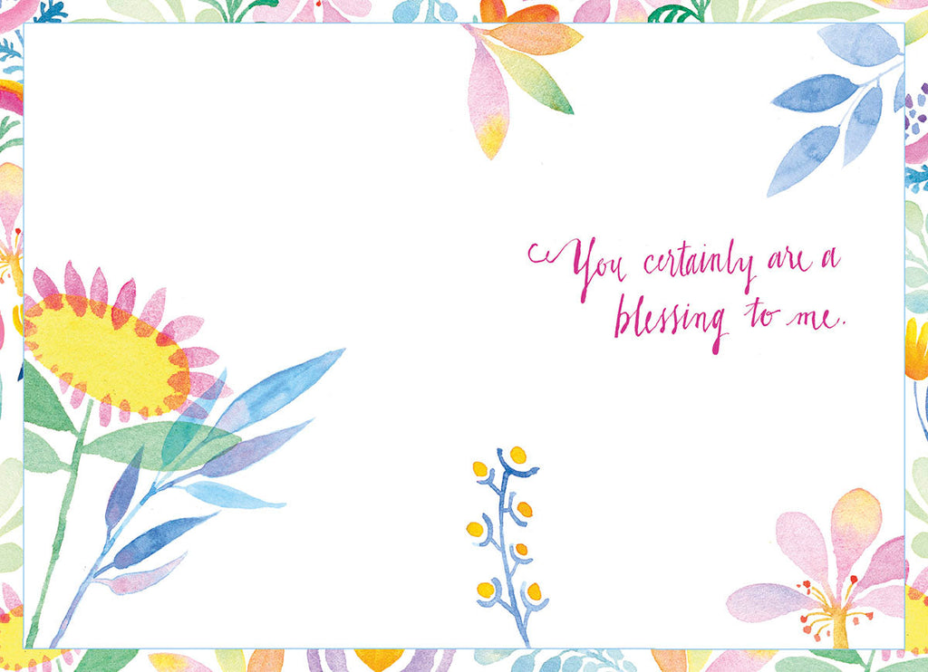 Inside of a thoughtful Easter card, showing 'You certainly are a blessing to me.' in magenta script, framed by delicate watercolor floral designs in spring pastels.