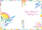 Inside of a thoughtful Easter card, showing 'You certainly are a blessing to me.' in magenta script, framed by delicate watercolor floral designs in spring pastels.