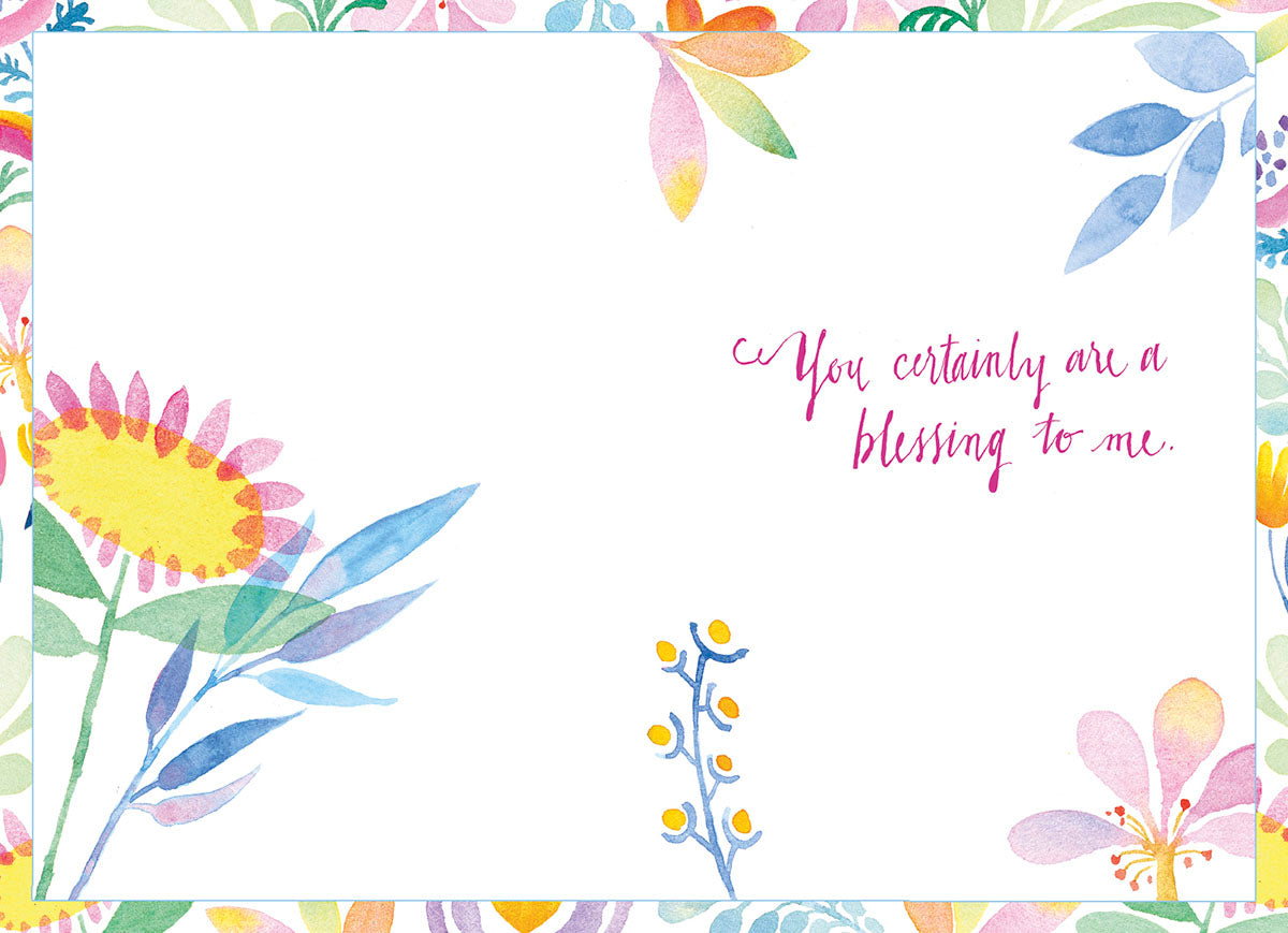 Inside of a thoughtful Easter card, showing 'You certainly are a blessing to me.' in magenta script, framed by delicate watercolor floral designs in spring pastels.