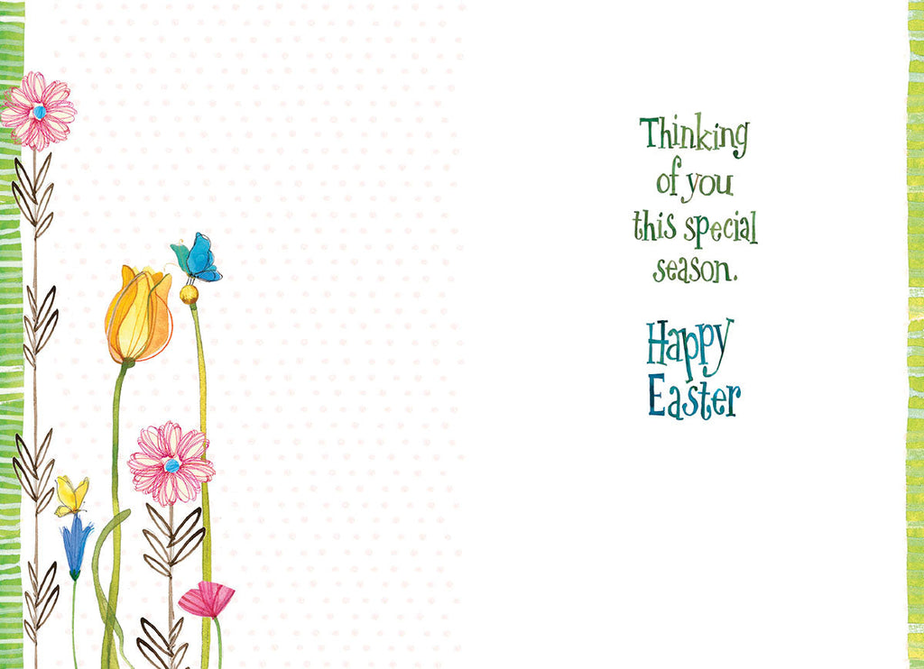 Inside view of an Easter greeting card displaying colorful spring flowers along the left border, a blank space for a personal message, and the printed text 'Thinking of you this special season. Happy Easter' on the right side.