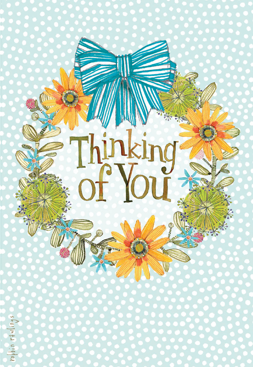 Colorful 'Thinking of You' greeting card with a whimsical floral wreath, yellow and green flowers, and a blue striped bow on a polka dot background.