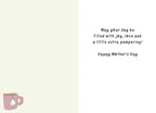 Inside of a thoughtful Mother's Day card, displaying a heartfelt message in script font: 'May your day be filled with joy, love and a little extra pampering! Happy Mother's Day'. A corner of a pink teacup is visible, complementing the card's relaxation theme.