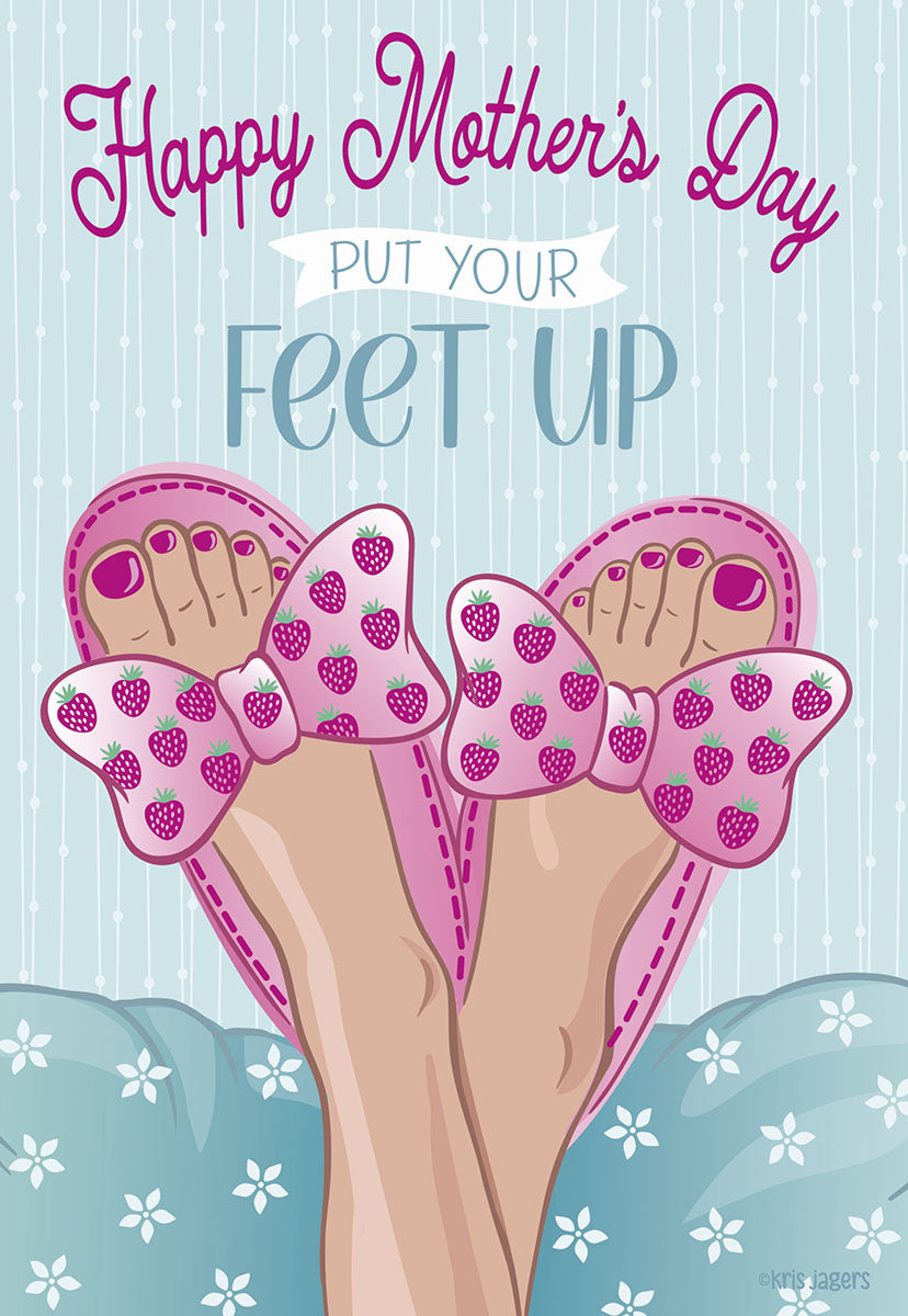 Front of a cheerful Mother's Day greeting card showing feet in pink strawberry slippers relaxing on a light blue pillow, with text 'Happy Mother's Day Put Your Feet Up' on a striped background.