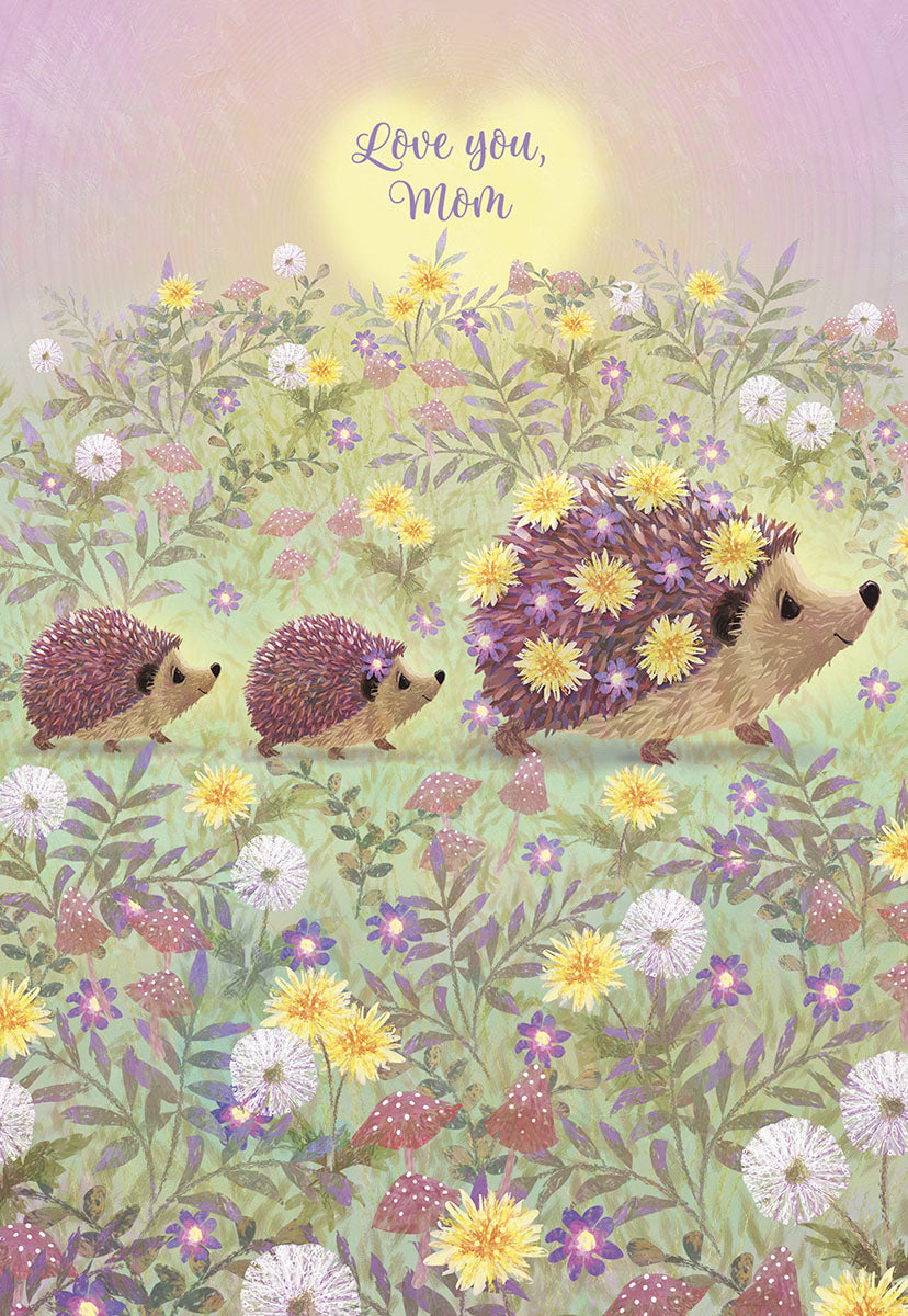 Charming Mother's Day greeting card featuring an illustrated mama hedgehog leading two baby hedgehogs through a vibrant field of yellow and purple wildflowers under a warm sun, with 'Love you, Mom' text at the top, ideal for expressing heartfelt appreciation.