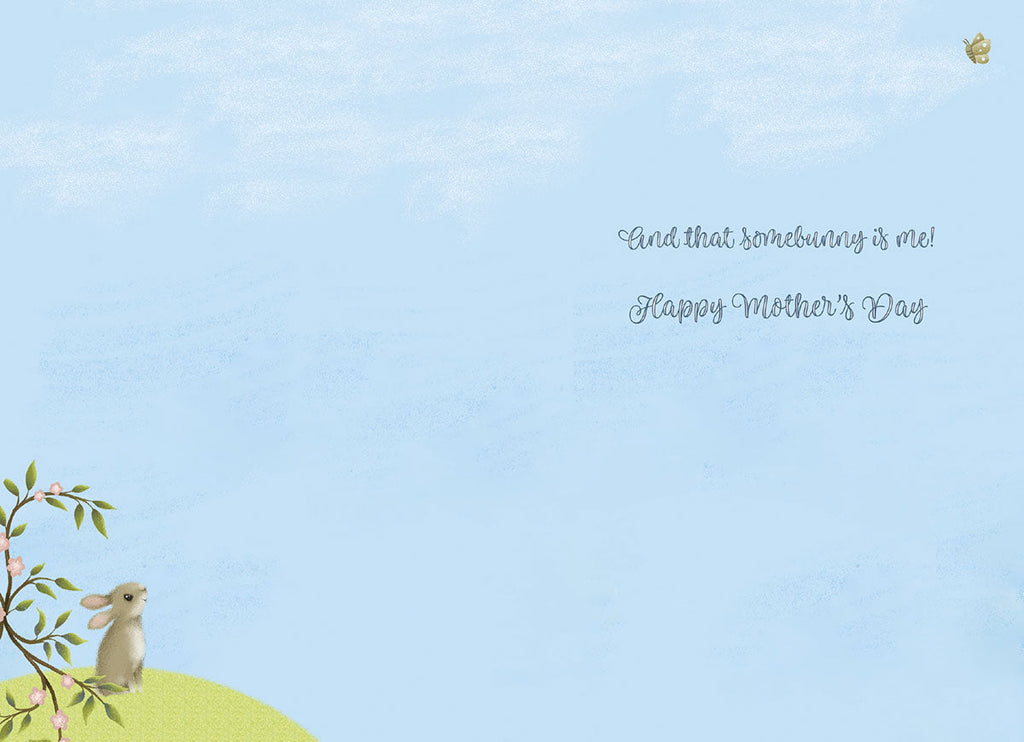 Inside view of a sweet Mother's Day card, displaying a pastel blue sky background with a small bunny and flowering branch in the corner. Text reads 'and that somebunny is me! Happy Mother's Day'.