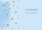 Inside of the Father's Day greeting card, showing a light blue background with scattered gold stars. The heartfelt message reads: 'You've won my heart, and every day you win at being an amazing dad. Our family is so lucky to have you!'