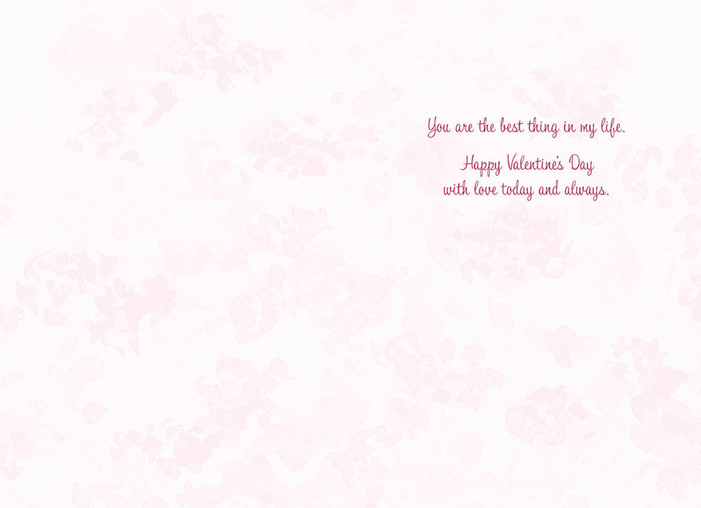 Inside of a romantic Valentine's Day card with a soft pink floral background. The heartfelt message reads in elegant script: "You are the best thing in my life. Happy Valentine's Day with love today and always."