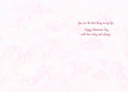 Inside of a romantic Valentine's Day card with a soft pink floral background. The heartfelt message reads in elegant script: "You are the best thing in my life. Happy Valentine's Day with love today and always."