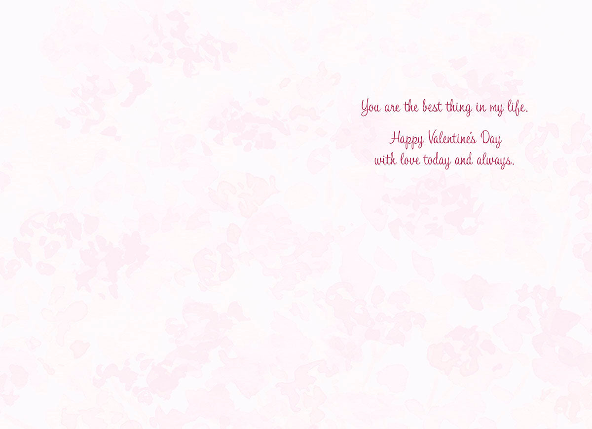 Inside of a romantic Valentine's Day card with a soft pink floral background. The heartfelt message reads in elegant script: "You are the best thing in my life. Happy Valentine's Day with love today and always."