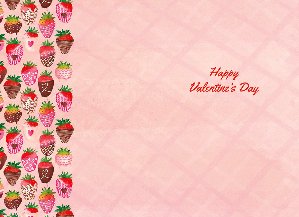 Open view of the inside of a Valentine's Day greeting card showing a blank pink space for a personal message, bordered by decorative chocolate-dipped strawberries, and the greeting 'Happy Valentine's Day' in red script.