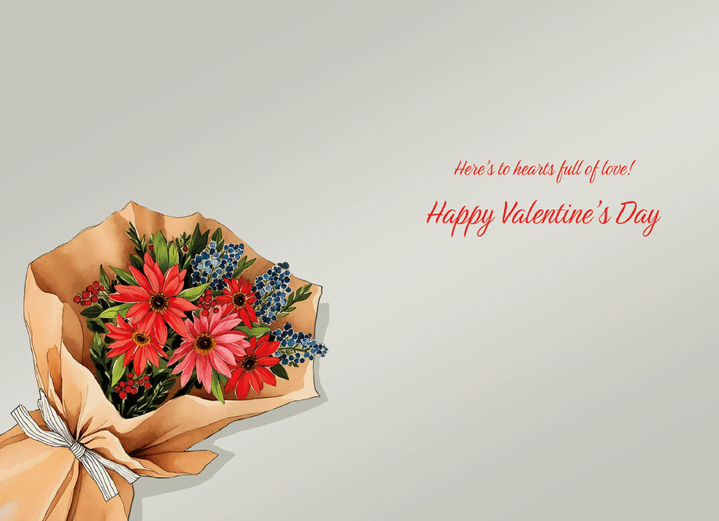 The inside of a Valentine's Day greeting card showing a vibrant watercolor illustration of a bouquet of red and pink flowers with blue berries wrapped in kraft paper. Text on the inside reads 'Here's to hearts full of love! Happy Valentine's Day' in red script.