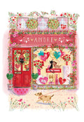 A charming, vibrant storefront with an 'AMORE' sign, overflowing with red flowers, heart balloons, and cute pets (a dog on a leash and a cat in the window), depicting a romantic Valentine's Day scene.