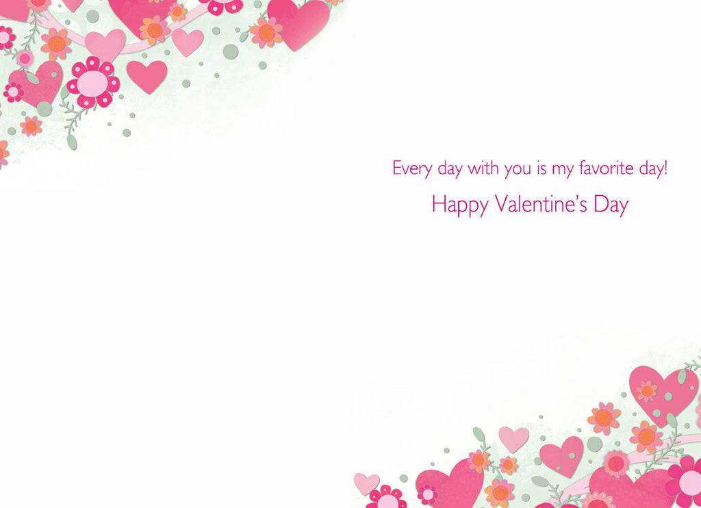 Open view of a heartfelt greeting card interior showing a white background with decorative corners of pink hearts and flowers. Reads 'Every day with you is my favorite day! Happy Valentine's Day' in fuchsia text.