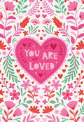 Vibrant floral greeting card for Valentine's Day featuring a central pink heart with 'YOU ARE LOVED' surrounded by pink, red, and green flowers and leaves on a white background, perfect for a friend or loved one.
