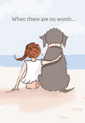 Watercolor illustration of a small figure with red hair hugging a large grey dog on a sandy beach with the ocean in the background, text 'When there are no words...' on a support greeting card for friends.
