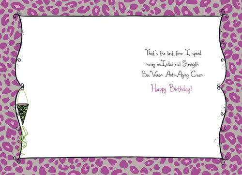 Inside of a humorous birthday greeting card, revealing the witty punchline 'That's the last time I spend money on Industrial Strength Bee Venom Anti-Aging Cream. Happy Birthday!' against a playful purple leopard print border.