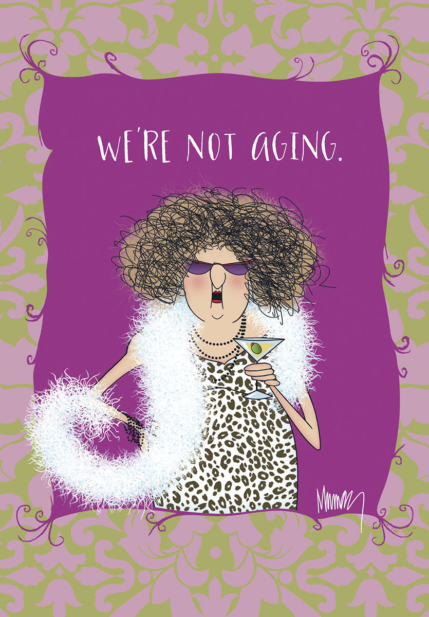 Funny birthday card for her featuring a sassy woman with messy hair, sunglasses, leopard print dress, and white boa, holding a martini. Text reads: 'WE'RE NOT AGING.'