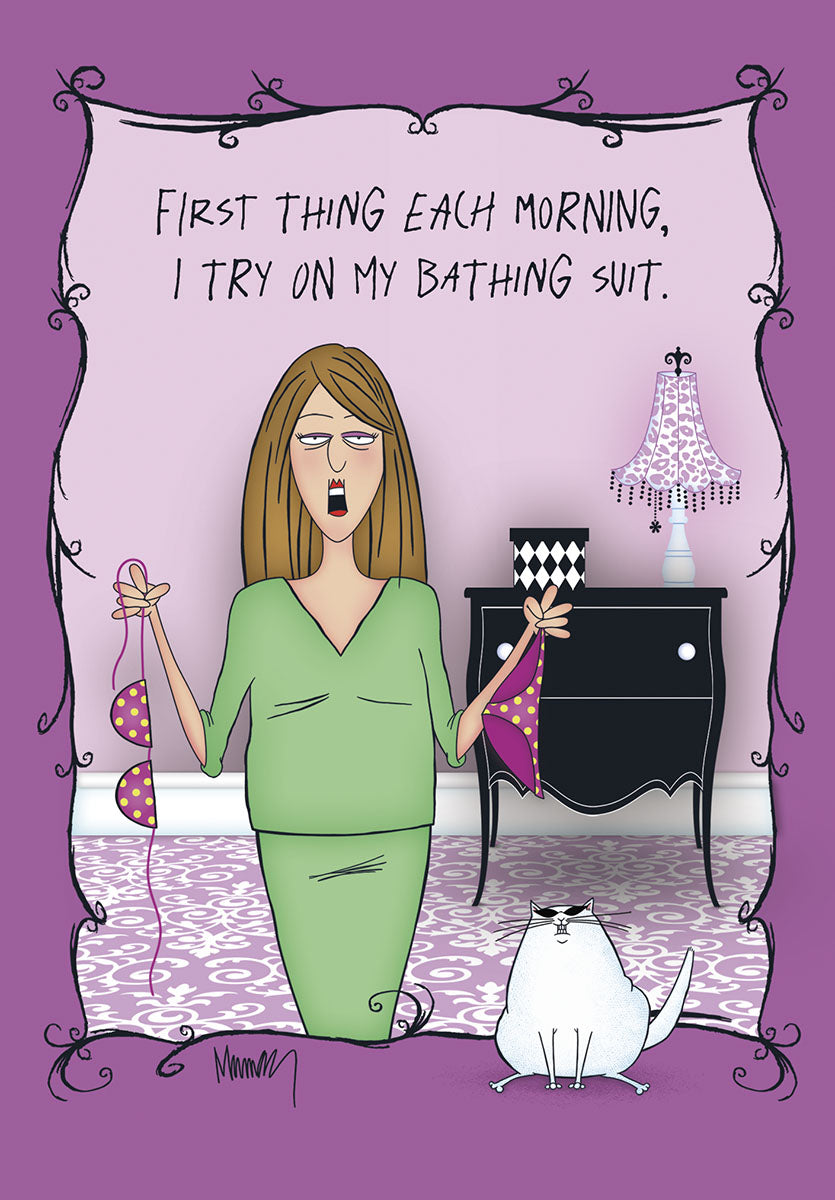Funny greeting card featuring a cartoon woman in a green dress looking distressed, holding a pink polka-dot bikini top. A smug white cat sits nearby. The caption reads 'FIRST THING EACH MORNING, I TRY ON MY BATHING SUIT.'