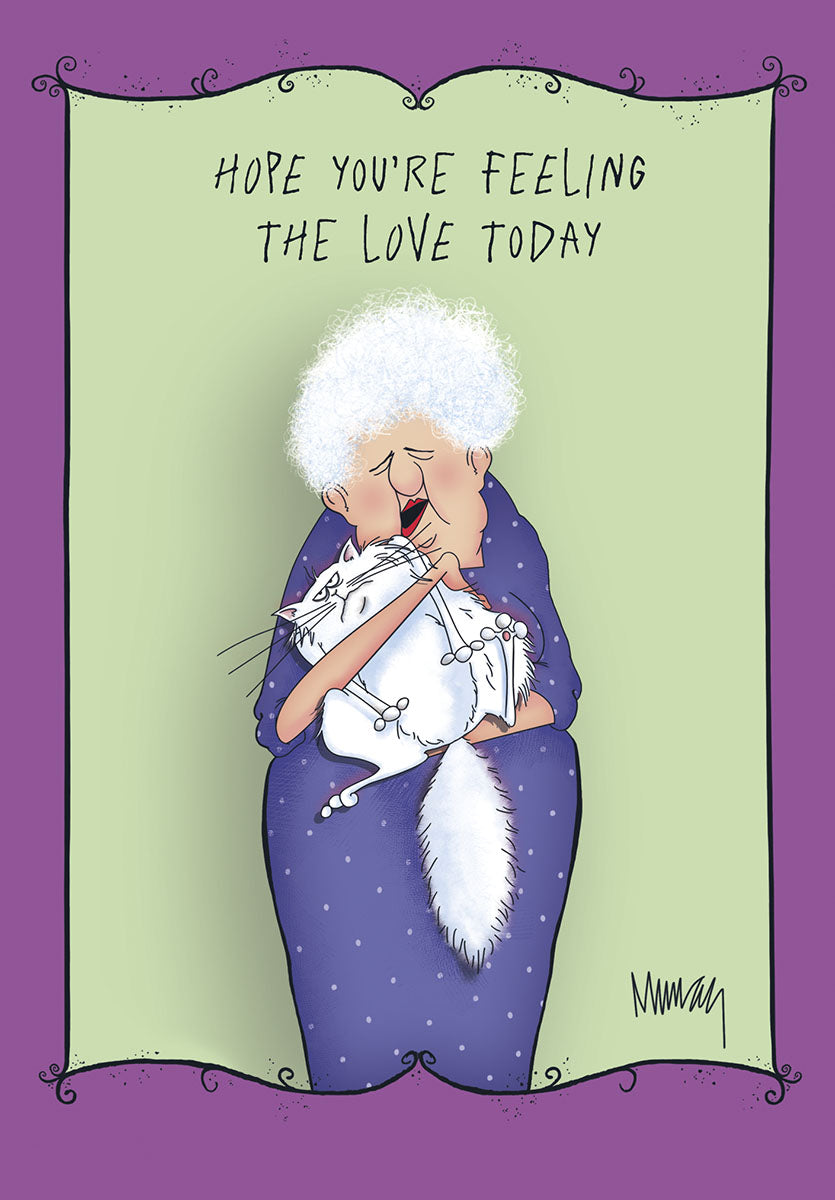 Heartfelt greeting card featuring a sweet illustration of an elderly woman with white curly hair gently hugging a fluffy white cat, set against a light green background with a whimsical purple ornate border. Text reads 'HOPE YOU'RE FEELING THE LOVE TODAY'.