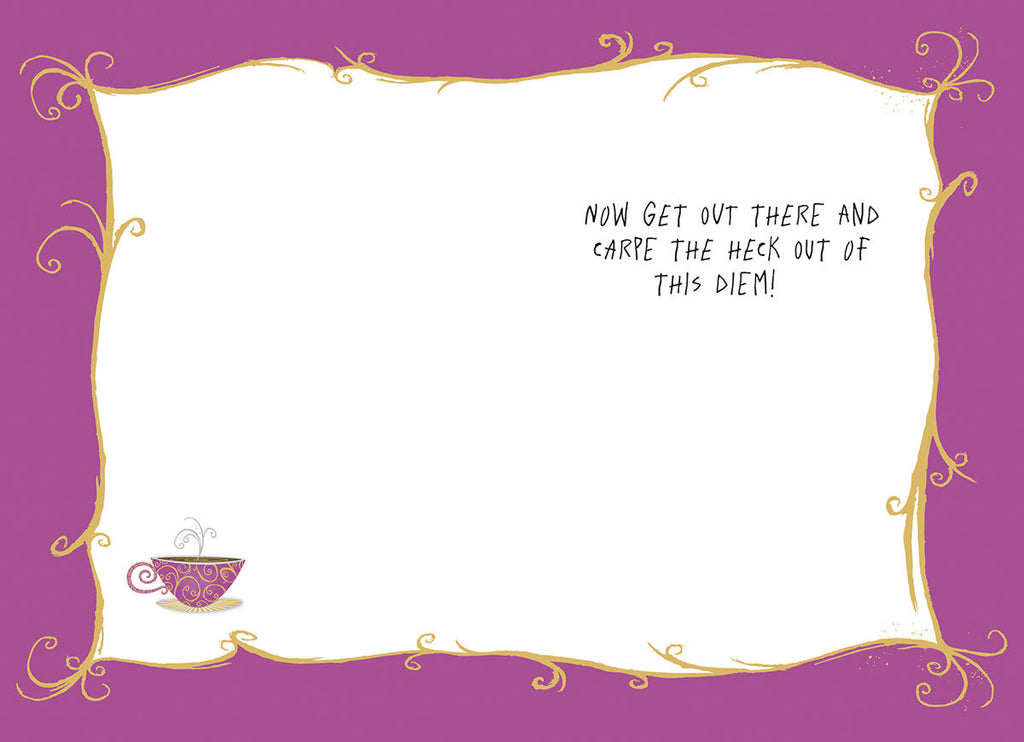 Inside view of a lighthearted encouragement greeting card with a blank white space for writing a personal message. It is surrounded by a decorative purple border with elegant swirls and features a small, artistic teacup illustration in the bottom left corner. The printed message reads 'NOW GET OUT THERE AND CARPE THE HECK OUT OF THIS DIEM!'