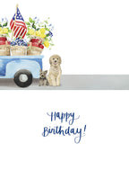 Inside of a cute greeting card showing a golden doodle and yorkie sitting next to a blue watercolor pickup truck, with 'Happy Birthday!' in elegant script.