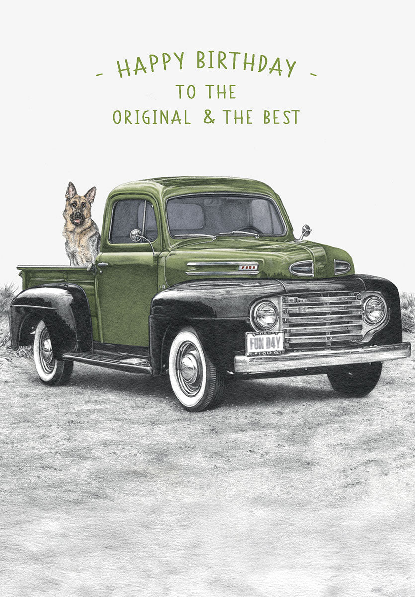 Vintage green Ford pickup truck with a German Shepherd dog in the bed, front of a birthday card for him, celebrating an original and the best friend.