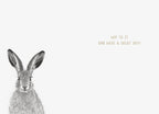 Interior of a greeting card featuring the left side of a brown hare with large ears on a light cream background, with gold text 'HOP TO IT AND HAVE A GREAT DAY!' to the right. Ideal for a playful message.