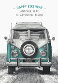 Front of a greeting card featuring a detailed pencil drawing of a teal and white vintage Volkswagen Kombi van parked in tall grass, with text 'HAPPY BIRTHDAY - ANOTHER YEAR OF ADVENTURE BEGINS'.
