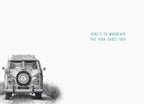 Interior of an adventure-themed birthday card, showing a subtle illustration of a vintage camper van in the bottom left corner. The uplifting message reads: 'HERE'S TO WHEREVER THE YEAR TAKES YOU!'. Perfect for conveying inspiring wishes.