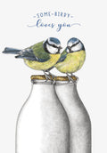 Cute friendship greeting card featuring two colorful blue tit birds perched on vintage milk bottles with the text 'SOME-BIRDY loves you'.