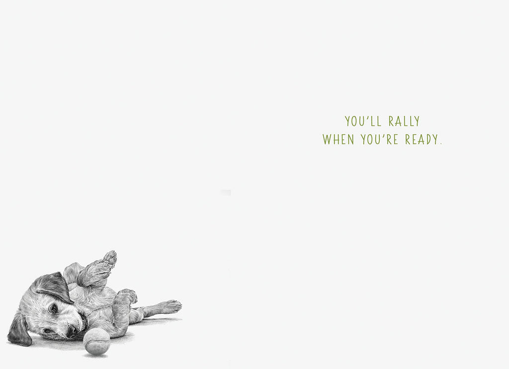 Inside of a supportive greeting card with a small illustration of a puppy on its back and text 'You'll rally when you're ready.'.