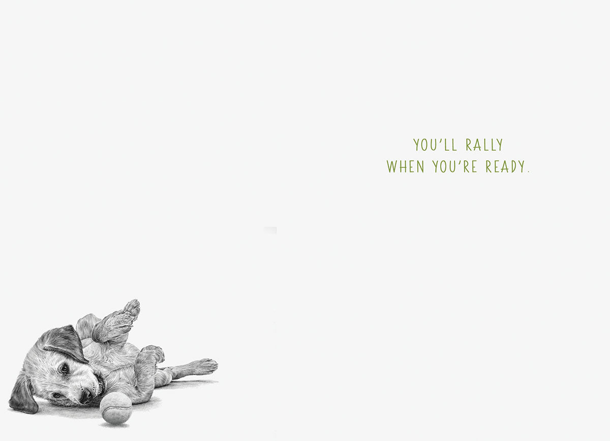 Inside of a supportive greeting card with a small illustration of a puppy on its back and text 'You'll rally when you're ready.'.
