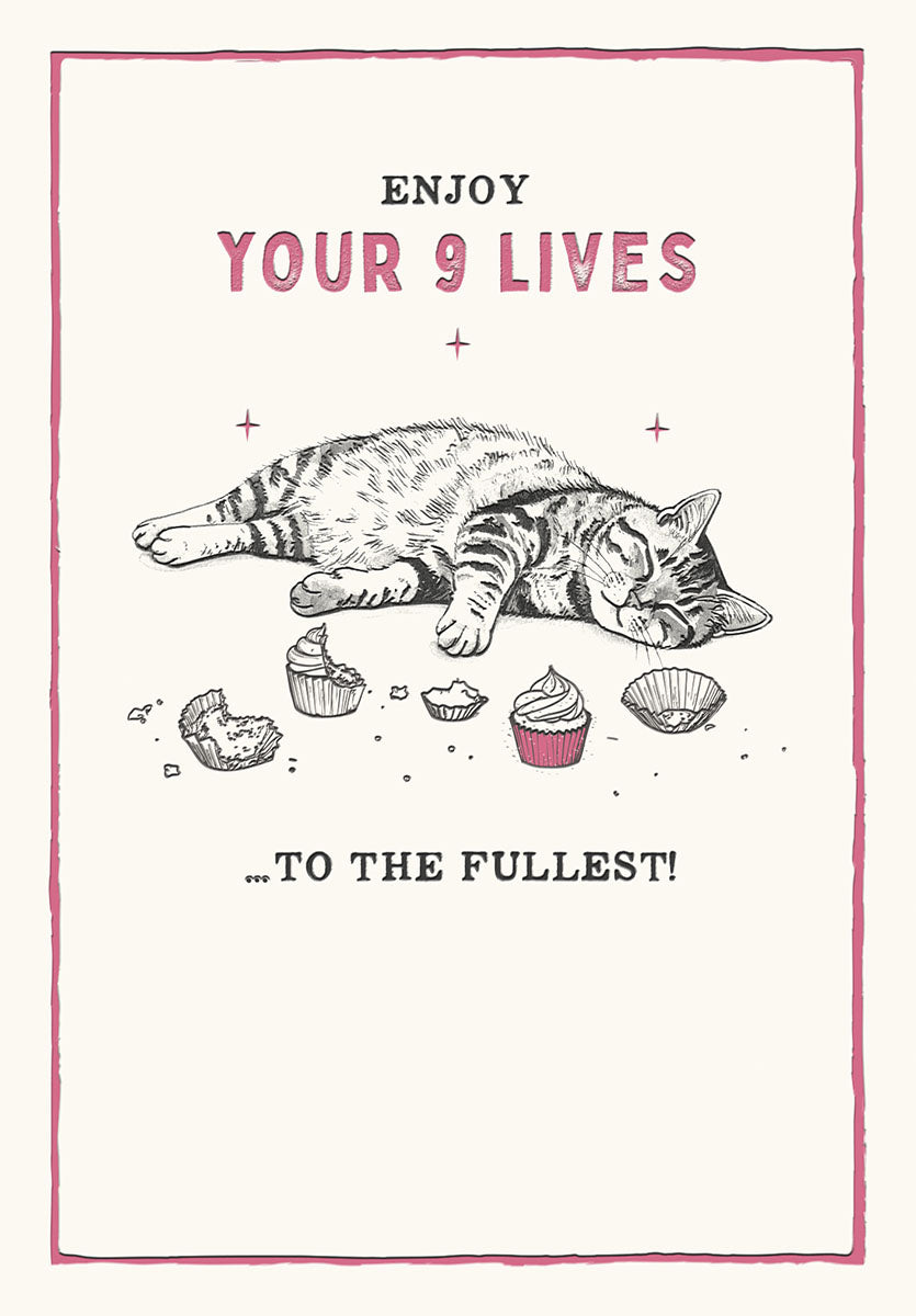 Funny greeting card front featuring a content tabby cat sound asleep amidst eaten cupcake wrappers and untouched cupcakes, with text 'ENJOY YOUR 9 LIVES ...TO THE FULLEST!' in a pink border, perfect for cat lovers.
