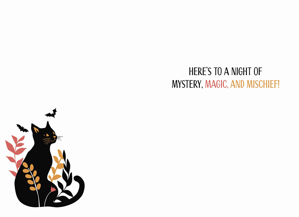 Inside of a Halloween greeting card with a small black cat illustration and the text 'HERE'S TO A NIGHT OF MYSTERY, MAGIC, AND MISCHIEF!'.