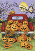 Charming Halloween greeting card featuring a red vintage pickup truck filled with glowing jack-o'-lanterns, a playful black cat, an owl on a tree branch, and a full moon under a purple night sky. Perfect for children's spooky season wishes.