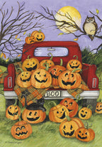Charming Halloween greeting card featuring a red vintage pickup truck filled with glowing jack-o'-lanterns, a playful black cat, an owl on a tree branch, and a full moon under a purple night sky. Perfect for children's spooky season wishes.
