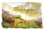 Front of a watercolor Thanksgiving greeting card depicting a golden autumn landscape with purple and green accents, featuring the words "Happy Thanksgiving" in elegant script.