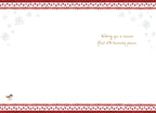 Inside of a religious greeting card with a serene message 'Wishing you a season filled with heavenly peace', adorned with delicate snowflake corners and red berry garland borders.