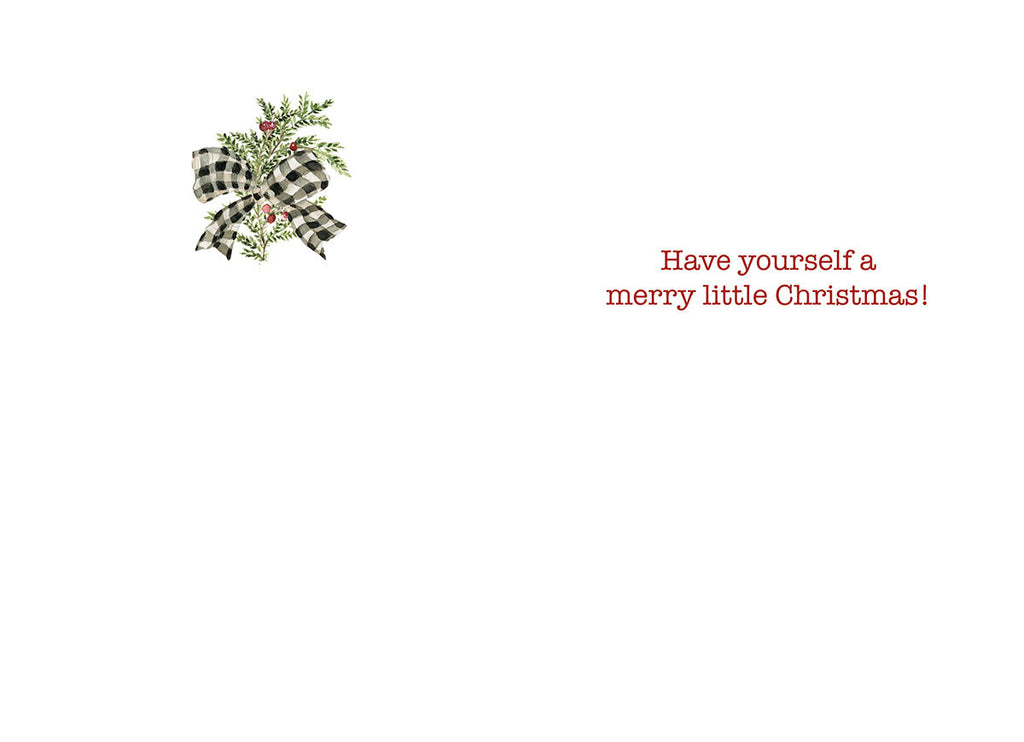 Inside of the holiday greeting card, showing a small watercolor sprig of greenery with red berries and a buffalo plaid bow in the top left corner. The main text in red script reads 'Have yourself a merry little Christmas!'.
