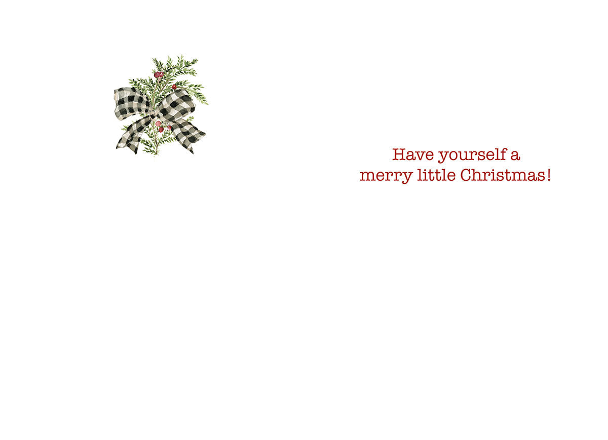 Inside of the holiday greeting card, showing a small watercolor sprig of greenery with red berries and a buffalo plaid bow in the top left corner. The main text in red script reads 'Have yourself a merry little Christmas!'.