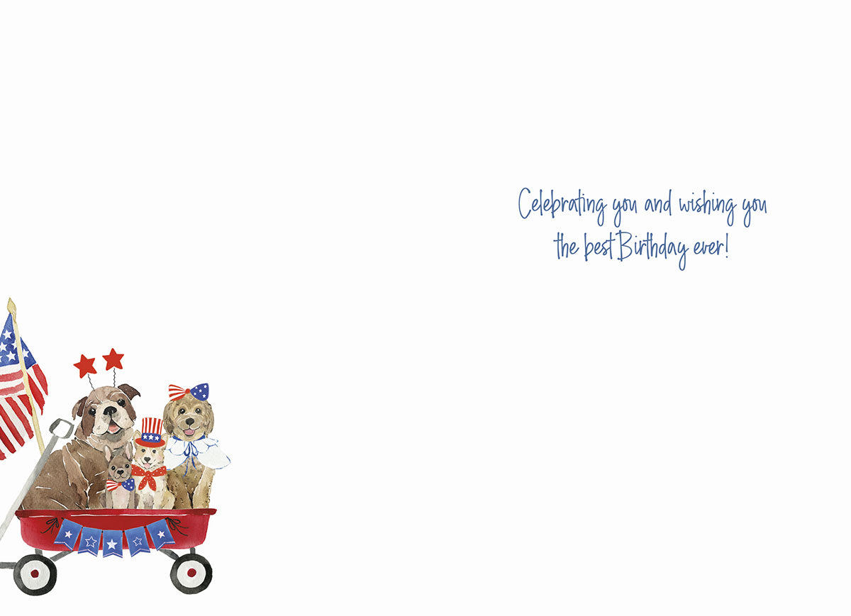 Inside of a cute patriotic dog birthday greeting card featuring the same dog illustration on the left and handwritten text 'Celebrating you and wishing you the best Birthday ever!' on the right.