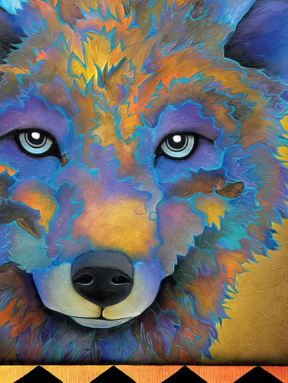 Close-up of a colorful wolf's face, painted with intricate patterns and bright blue eyes, on a greeting card.