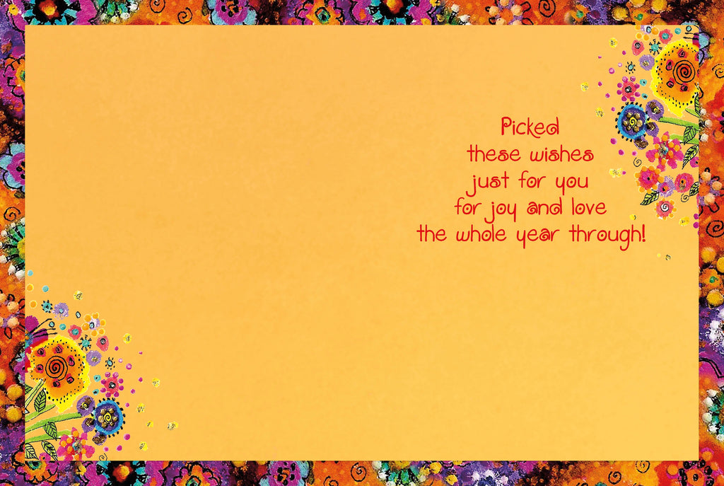 Inside of a lighthearted greeting card with an orange background and a cheerful, colorful floral border, featuring the printed message 'Picked these wishes just for you for joy and love the whole year through!'.
