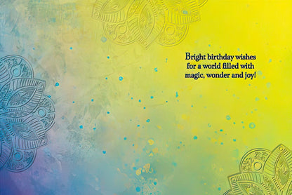 Inside of a greeting card with text: 'Bright birthday wishes for a world filled with magic, wonder and joy!' on a colorful background.