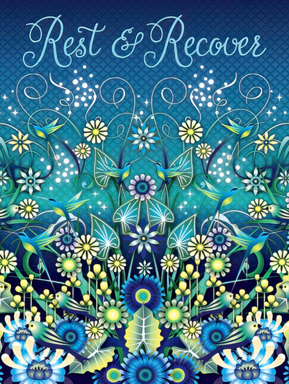 Front of a Get Well Soon greeting card, predominantly blue, featuring "Rest & Recover" in elegant script above vibrant floral patterns with blue and yellow flowers and hummingbirds.