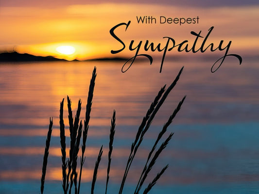 Deepest Sympathy greeting card with a serene sunset over water and silhouetted reeds, expressing condolences during loss.