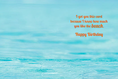 Inside of a birthday greeting card with light blue ocean water background and orange text: 'I got you this card because I know how much you like the beach. Happy Birthday.'