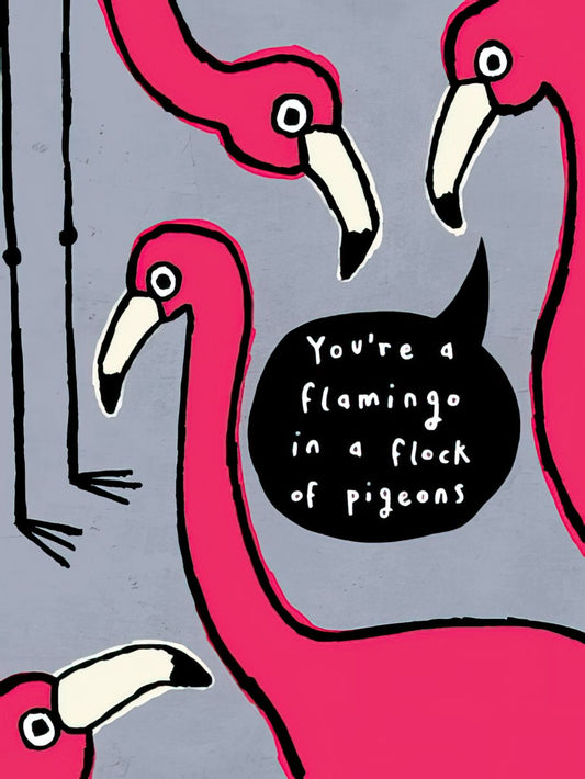 Front of a vibrant pink flamingo birthday card with the message 'You're a flamingo in a flock of pigeons' in a speech bubble.